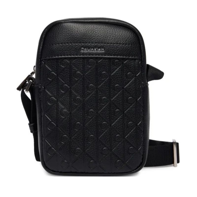 Borseta Calvin Klein EMBLEM AOP EMBOSS SLIM REPORTER Unisex